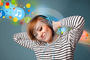 Young woman listening to music with headphones