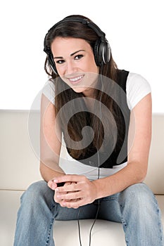 Young woman listening to music, isolated