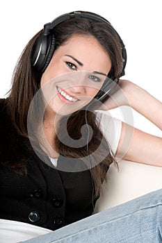 Young woman listening to music, isolated