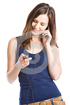 Young woman listening to music on mp3 player