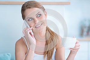 Young woman listening to a phone conversation