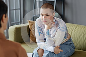 Young woman listening to psychologist