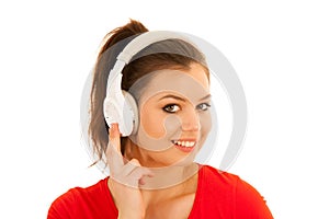 young woman listens music with headset isolated over white background