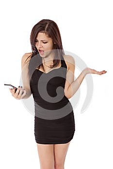 Young woman in a little black dress is upset by something she se