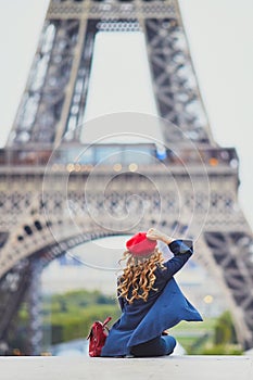 Young woman with long blond curly hair in Paris, France