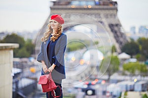 Young woman with long blond curly hair in Paris, France