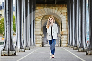 Young woman with long blond curly hair in Paris, France