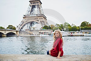 Young woman with long blond curly hair in Paris, France