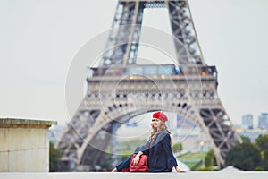 Young woman with long blond curly hair in Paris, France