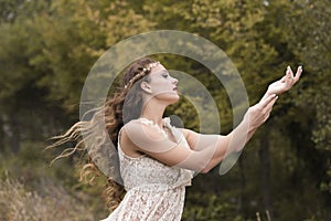 Young woman wear handmade look dress in forest