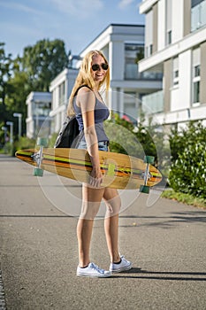 Young woman with a longboard