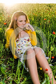 Young Woman look poppy field