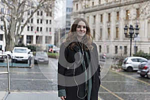 Young Woman Looking at Camera Posing in City photo