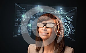 Young woman looking with futuristic smart high tech glasses