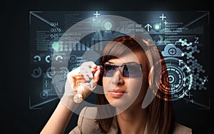 Young woman looking with futuristic smart high tech glasses