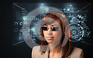 Young woman looking with futuristic smart high tech glasses