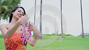 Young woman looking garland in lawn 4k