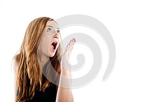 Young woman looking gasping in shock