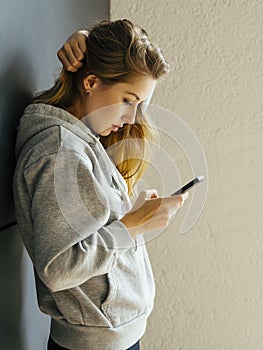 Young woman looking at her smartphone