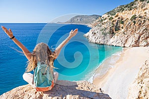 Young woman looking at Kaputas beach, Lycia coast, Turkey