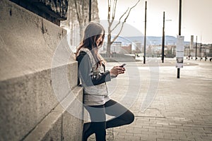 Young woman looking at the mobile phone