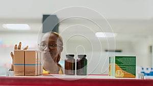 Young woman looking at pharmaceutical products
