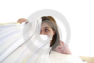 Young woman looking in a stack of papers