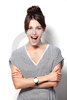 Young woman looking surprised on white background