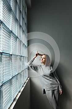 Young woman looking in window