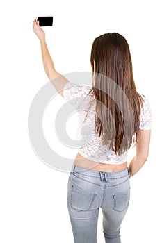 Young woman looks in camera on white background