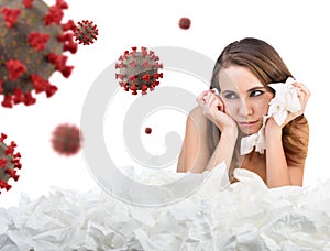 Young woman with a lot of hankys among coronavirus cells.