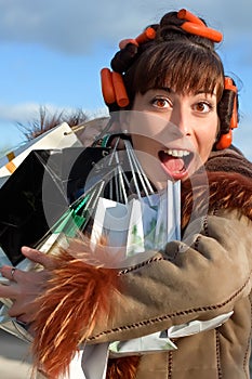 Young woman with lots of shopping bags.