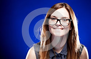 Young woman with lovely smile and nerd glasses