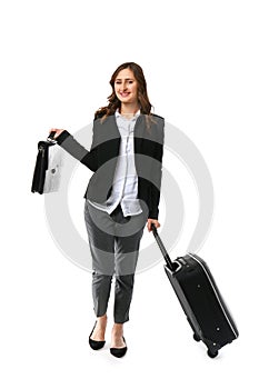 Young woman with luggage ready for business trip, on white background