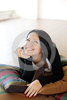 Young woman lying on the floo photo