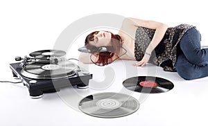 Young Woman Lying on the Floor Listening Music