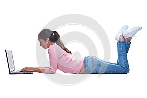 Young woman lying on floor using a laptop