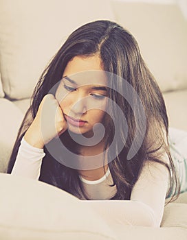 Young woman lying and melancholy