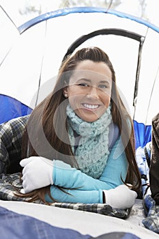 Young Woman Lying In Sleeping Bag In Tent