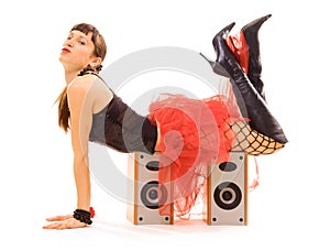 Young woman lying on speakers