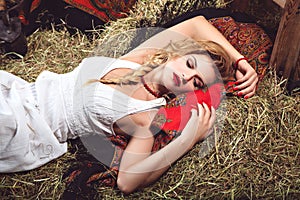 young woman lying on the straw