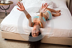 Young woman lying upside down.