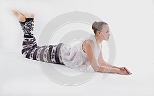 A young woman lying in white space