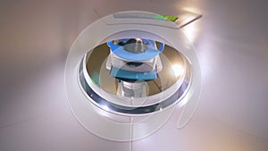 Young woman on a magnetic resonance imaging MRI scan in a modern hospital.