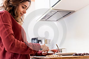 Young woman making cookies