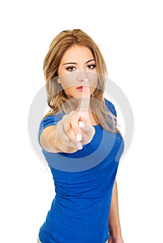 Young woman making disagree sign.