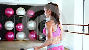 Young woman making exercise at the gym