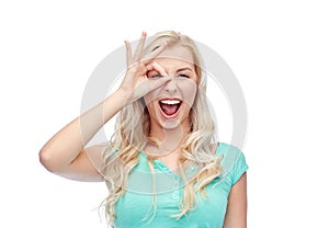 Young woman making ok hand gesture