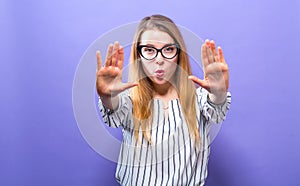 Young woman making a rejection pose