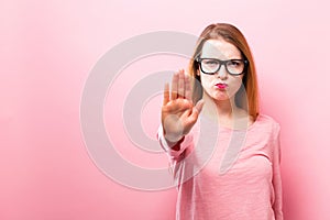 Young woman making a rejection pose